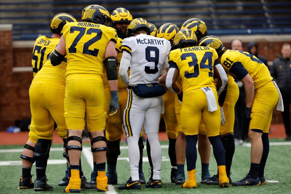 Michigan Wolverines quarterback J.J. McCarthy huddles up on offense during the spring game at Michigan Stadium, April 1, 2023 in Ann Arbor.