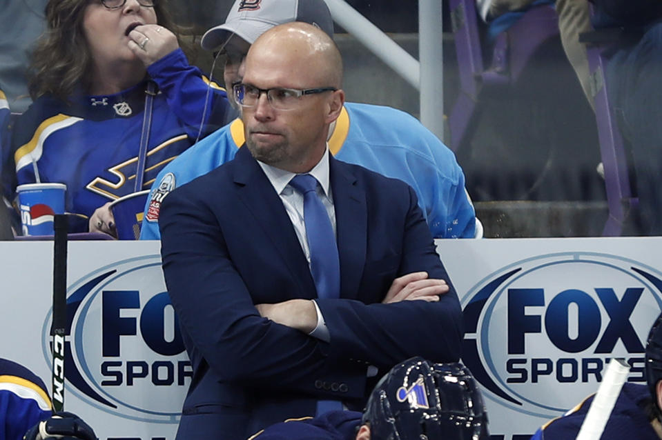 FILE - In this Thursday, Oct. 25, 2018, file photo, St. Louis Blues head coach Mike Yeo watches from the bench during the second period of an NHL hockey game against the Columbus Blue Jackets, in St. Louis. Early Tuesday, Nov. 20, 2018, Blues general manager Doug Armstrong announced that the team has fired Yeo and named Craig Berube as his interim replacement. (AP Photo/Jeff Roberson, File)