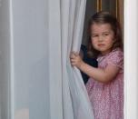 <p>Princess Charlotte taking a sneak peek before the ceremonies begin.</p>