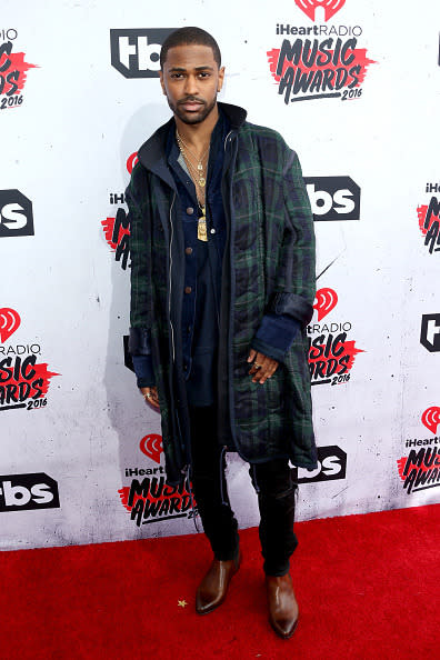 Big Sean wearing three coats. 