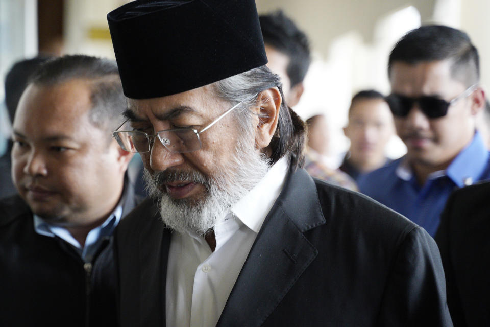 Former chief minister of Saba state on Borneo island, Musa Aman arrives at Kuala Lumpur High Court in Kuala Lumpur, Malaysia, Monday, Nov. 5, 2018. Malaysia's anti-graft agency said Monday that the former leader of a timber-rich eastern state has been arrested and will face corruption charges amid a widening crackdown on abuse by officials. (AP Photo/Yam G-Jun)