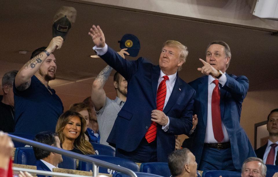 President Trump was a special guest at World Series Game 5, joined by Senator David Perdue of Georgia (right). (Photo by TASOS KATOPODIS/AFP via Getty Images)