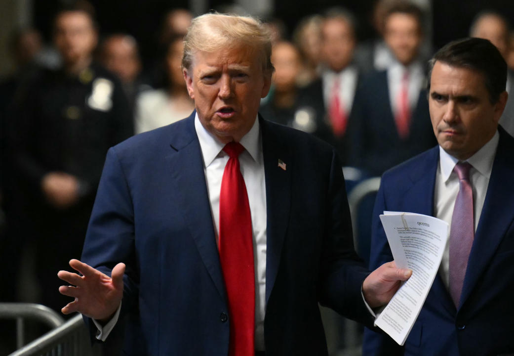 Former President Donald Trump speaks to the press outside of Manhattan criminal court on Friday.