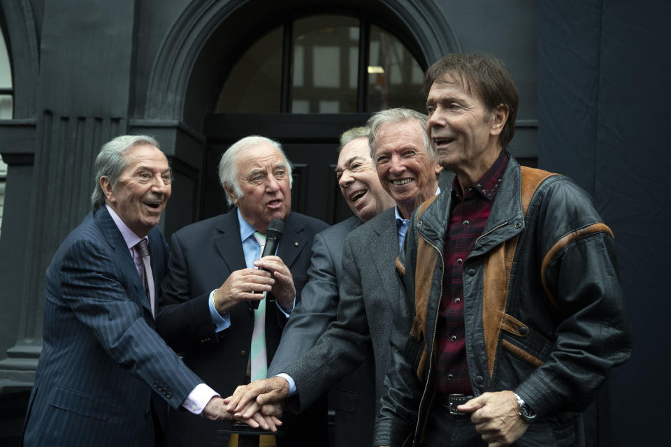 (left to right) Des OÕConnor, Jimmy Tarbuck, Lord Andrew Lloyd Webber, Tommy Steele and Sir Cliff Richard push the button for the curtain to drop and reveal the Wall of Fame, a new art installation at the London Palladium in London.