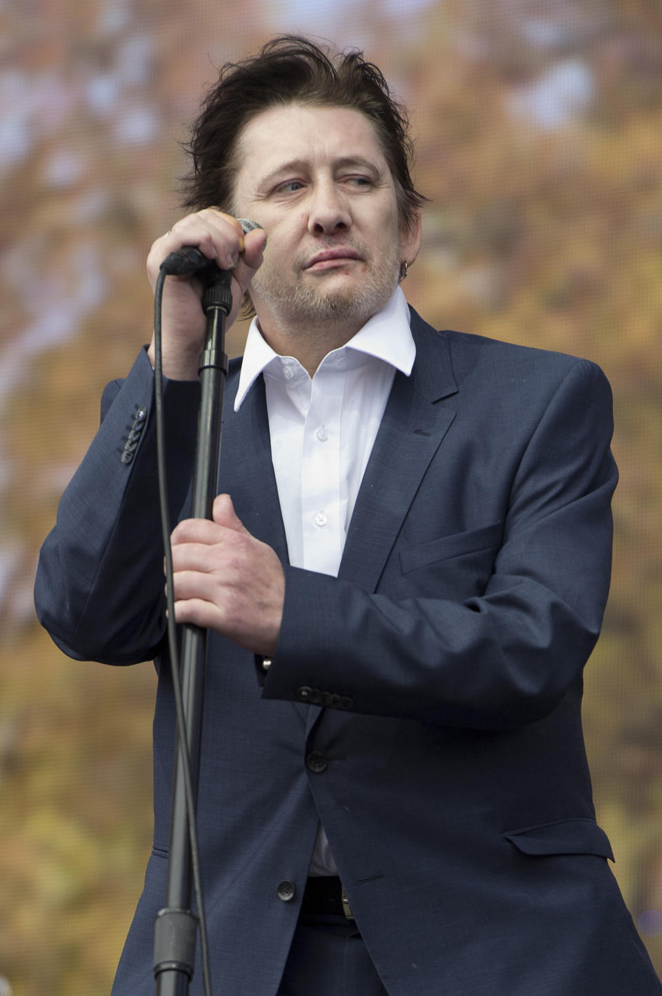 FILE - Shane MacGowan lead singer of The Pogues as the band performs at the Barclaycard British Summer Time Festival in Hyde Park, London, July 5, 2014. Macgowan, the singer-songwriter and frontman of The Pogues, best known for their ballad “Fairytale of New York,” has died. He was 65. His family said in a statement that "it is with the deepest sorrow and heaviest of hearts that we announce the passing of our most beautiful, darling and dearly beloved Shane Macgowan.” The singer died peacefully early Thursday, Nov. 30, 2023 with his family by his side, the statement added. (Laura Lean/PA via AP)