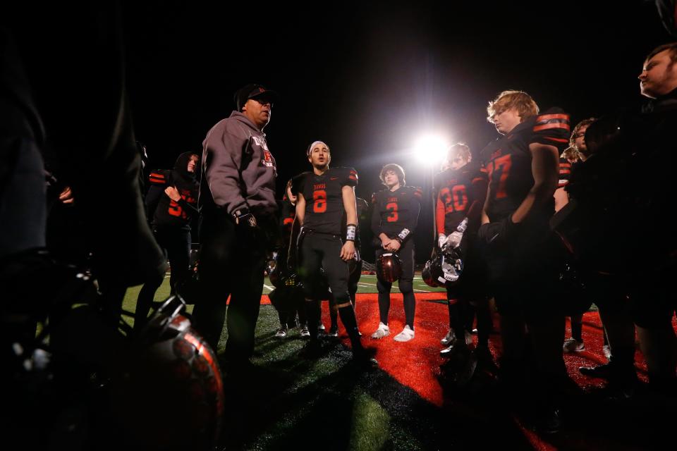 Rossville coach Derick Hammes gathers his players after celebrating their Class 2A Regional victory over Riverton.