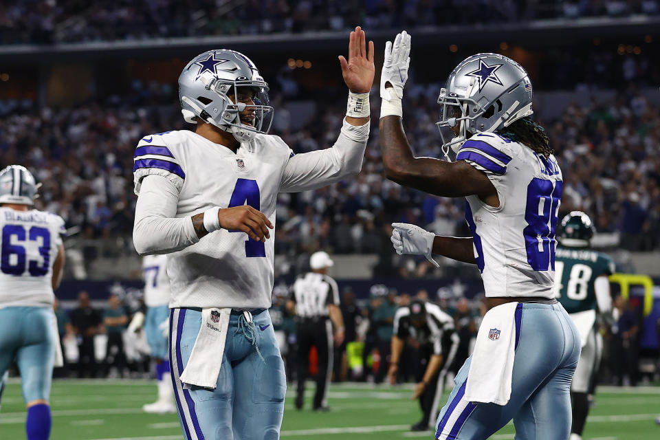 ARLINGTON, TEXAS - SEPTEMBER 27: CeeDee Lamb #88 of the Dallas Cowboys celebrates his second half touchdown with Dak Prescott #4 while playing the Philadelphia Eagles at AT&T Stadium on September 27, 2021 in Arlington, Texas. (Photo by Tom Pennington/Getty Images)