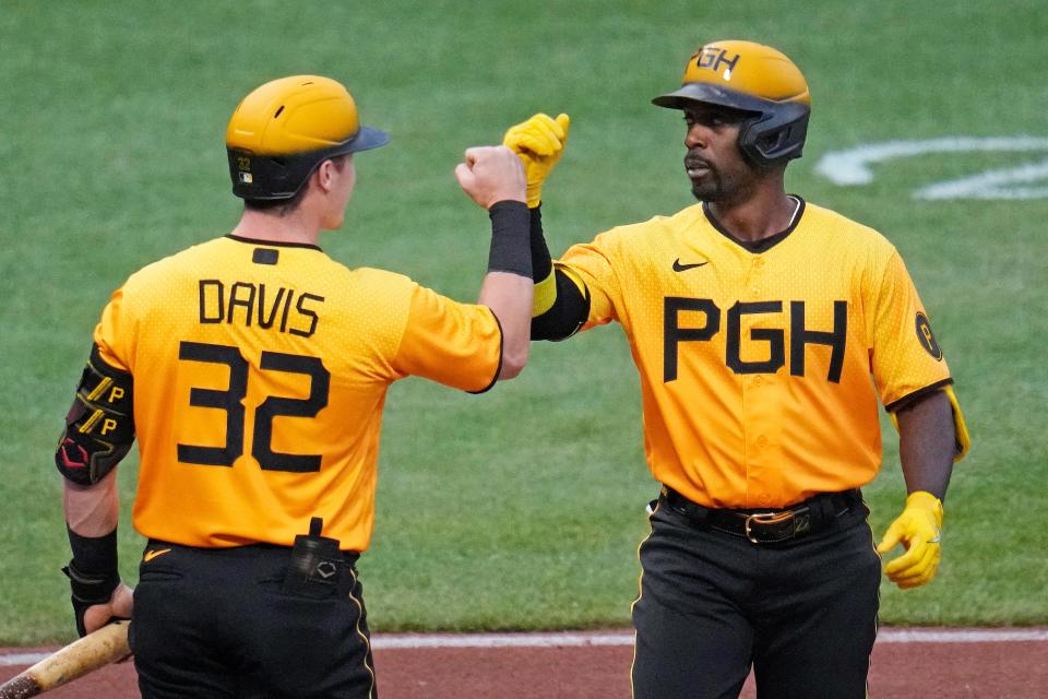 Pittsburgh Pirates' Andrew McCutchen, right, is greeted by Henry Davis after hitting a solo home run agianst the Milwaukee Brewers during the fourth inning of a baseball game in Pittsburgh, Friday, June 30, 2023. (AP Photo/Gene J. Puskar)