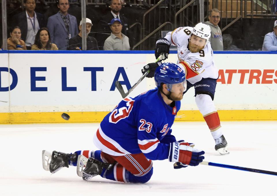 NEW YORK, NEW YORK - MAY 30: Sam Bennett #9 of the Florida Panthers takes the shot past Adam Fox #23 of the New York Rangers in Game Five of the Eastern Conference Final of the 2024 Stanley Cup Playoffs at Madison Square Garden on May 30, 2024 in New York City.