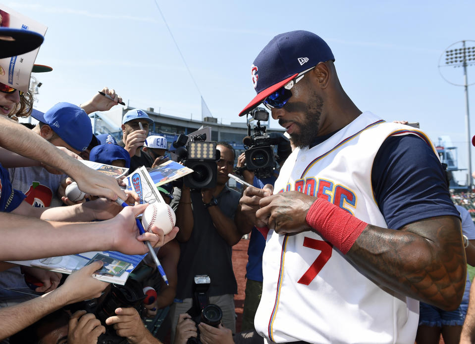 Jose Reyes signs autographs before a minor-league game with the Mets. (AP Photo/Kathy Kmonicek)