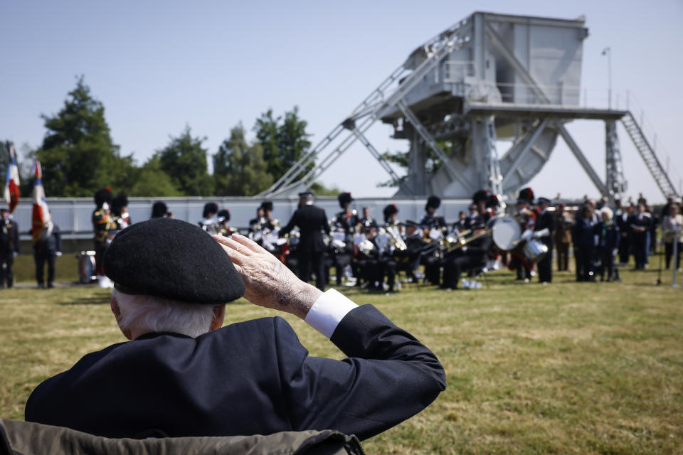A war veteran salutes during a ceremony ar the Pegasus Bridge, one of the first sites liberated by Allied forces from Nazi Germany, in Benouville, Normandy, Monday June 5, 2023. Dozens of World War II veterans have traveled to Normandy this week to mark the 79th anniversary of D-Day, the decisive but deadly assault that led to the liberation of France and Western Europe from Nazi control. (AP Photo/Thomas Padilla)