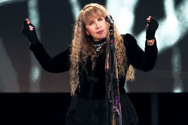<p> Kevin Mazur/WireImage</p> Stevie Nicks wears a 'Tortured Poets Department' bracelet while performing at BottleRock Napa Valley