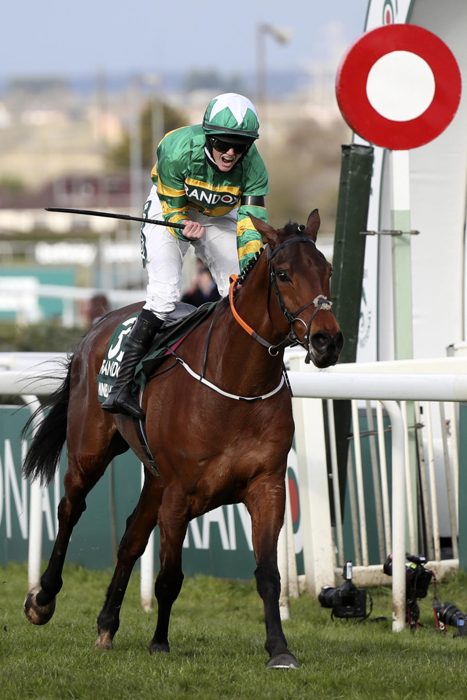 Rachael Blackmore ridding Minella Times wins the Randox Grand National Handicap Chase on the third day of the Grand National Horse Racing meeting at Aintree racecourse, near Liverpool, England, Saturday April 10, 2021. (AP Photo/Scott Heppell, Pool)