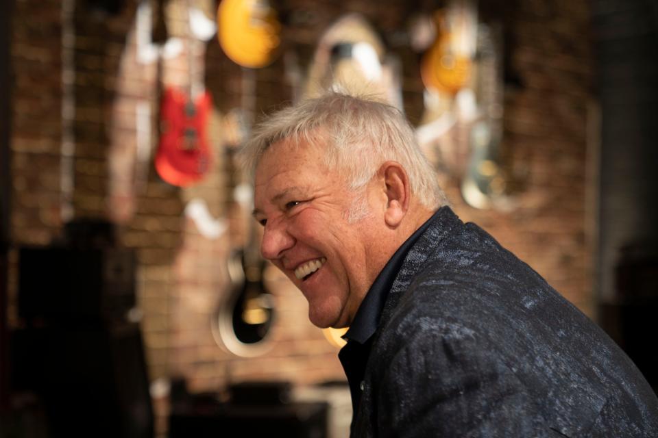 Rush guitarist Alex Lifeson smiles as he talks about teaming with Gibson Guitars' philanthropic wing Gibson Gives to donate roughly $40,000 to Monroe Children's Hospital and Room in the Inn during an interview at the Gibson Garage Tuesday, Aug. 16, 2022, in Nashville, Tenn.  