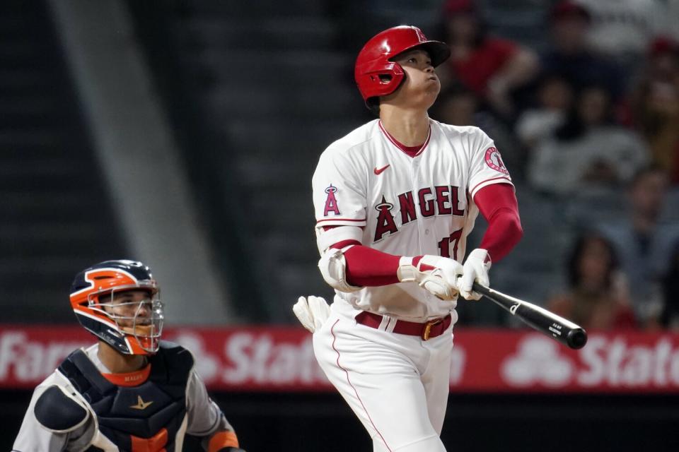 Angels' Shohei Ohtani follows through on his solo home run.