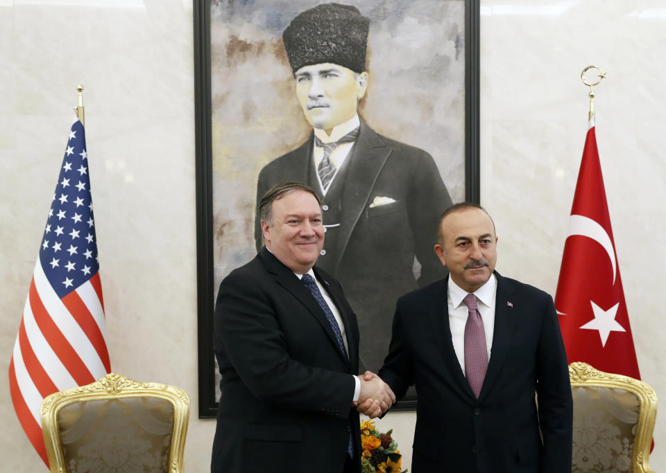 U.S. Secretary of State Mike Pompeo shakes hands with Turkish Foreign Minister Mevlut Cavusoglu before their talks in Ankara, Turkey, October 17, 2018. On Wednesday a pro-government Turkish newspaper published a report made from what they described as an audio recording of Saudi writer and journalist Jamal Khashoggi's alleged torture and slaying at the Saudi Consulate in Istanbul. (Leah Millis/Pool via AP)