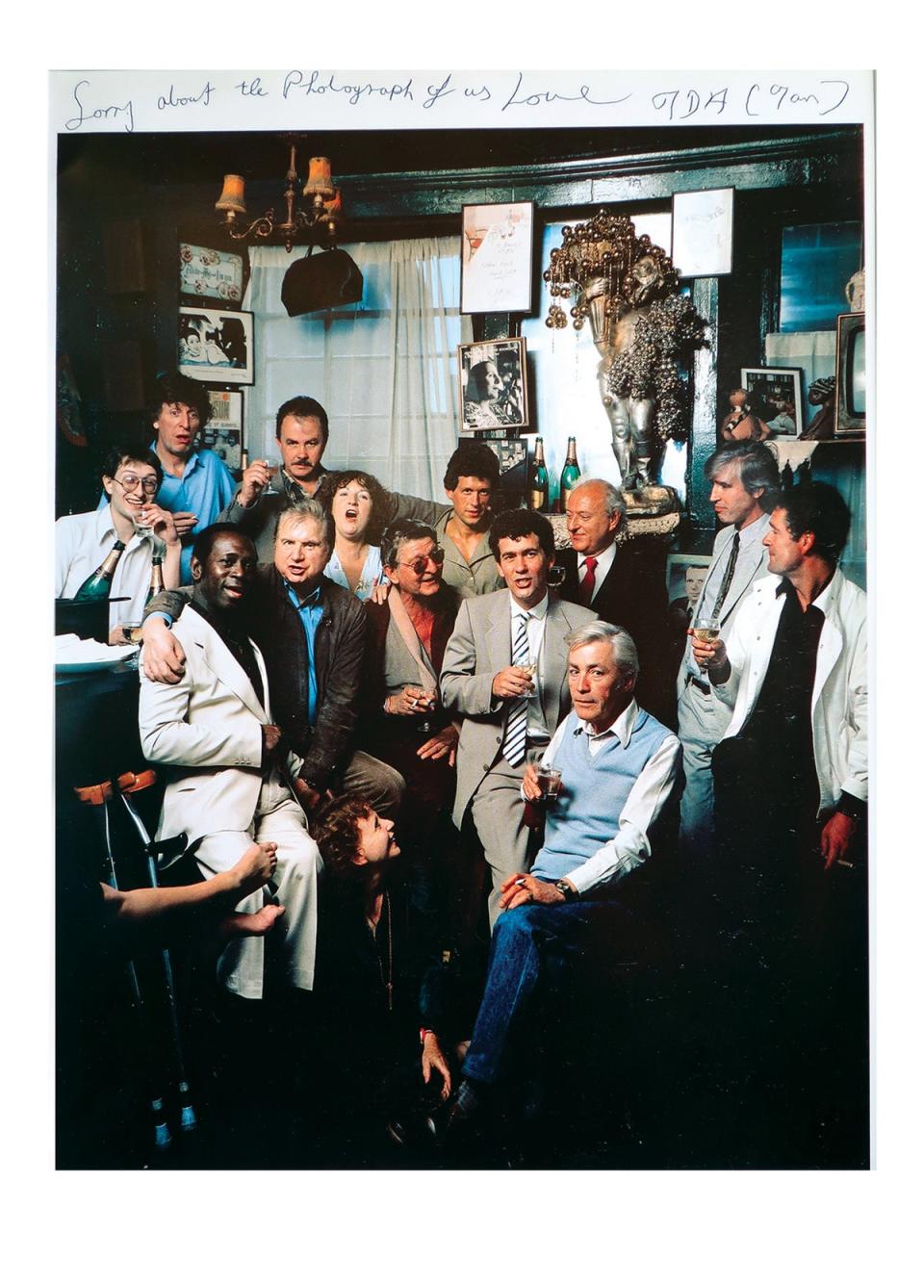 The club in 1983 included barman Michael Wojas, Tom Baker, Mike Mackenzie (pianist), Francis Bacon, Bruce Bernard, Thea Porter (dress designer, at Bacon’s feet), Ian Board (proprietor and barman), Michael Clark, John Edwards, Tony Panter, Jeffrey Bernard and John McEwen (Darren Coffield)