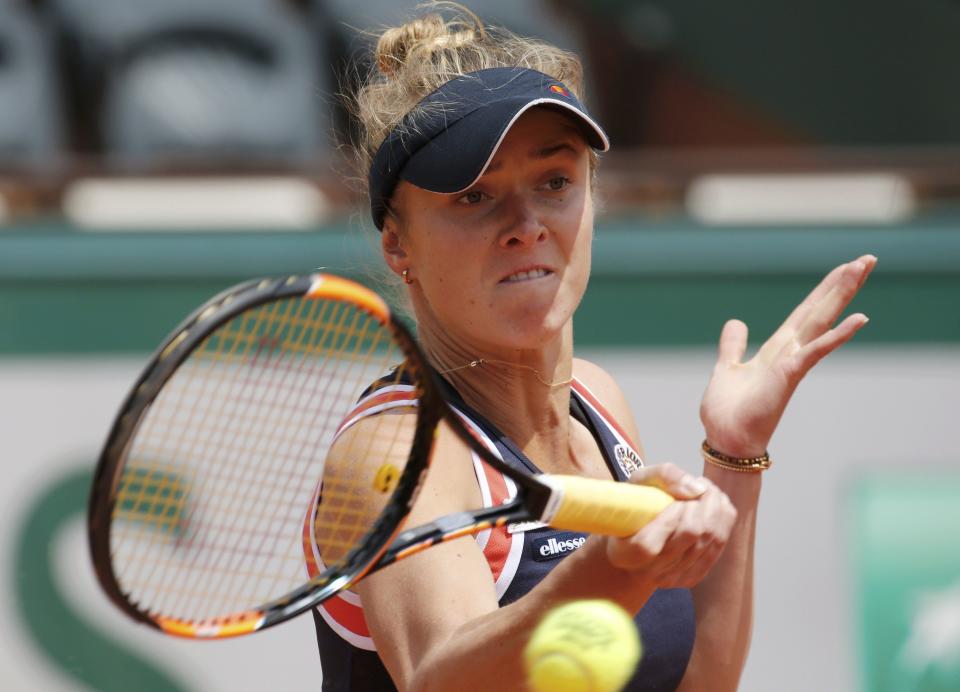 Elina Svitolina of Ukraine returns the ball to Ana Ivanovic of Serbia during their women's quarter-final match during the French Open tennis tournament at the Roland Garros stadium in Paris