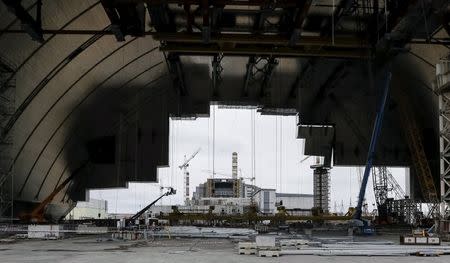 A general view shows the construction of the New Safe Confinement (NSC) structure at the site of the Chernobyl nuclear reactor, Ukraine, March 23, 2016. REUTERS/Gleb Garanich