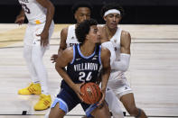 Villanova's Jeremiah Robinson-Earl, front, looks to shoot as Arizona State's Marcus Bagley, back left, and Jalen Graham defend during the first half of an NCAA college basketball game Thursday, Nov. 26, 2020, in Uncasville, Conn. (AP Photo/Jessica Hill)