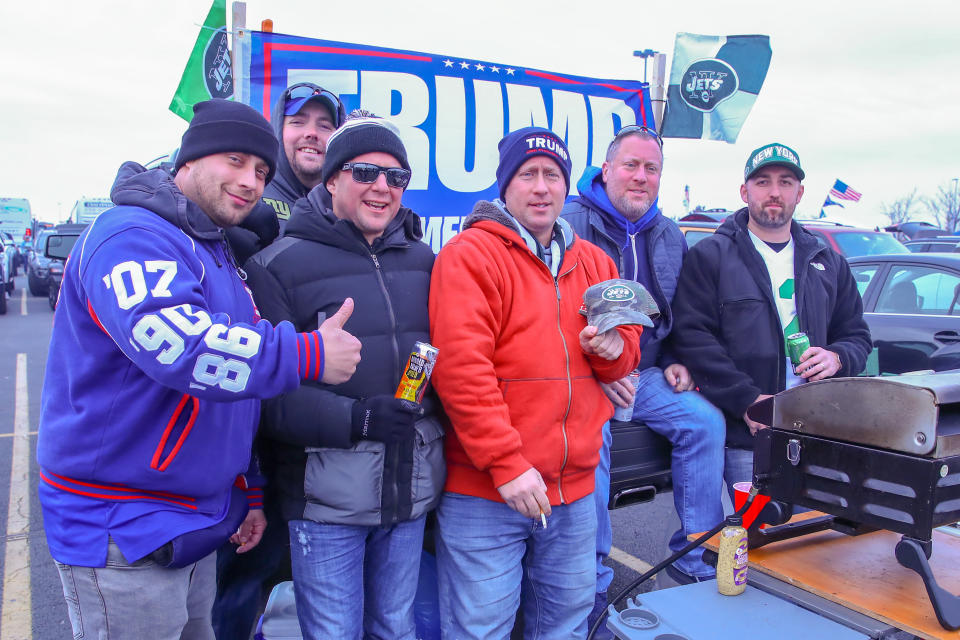 EAST RUTHERFORD, NJ - NOVEMBER 10:  A group of fans with their Trump 2020 flag outside MetLife Stadium prior to the National Football League game between the New York Jets and the New York Giants on November 10, 2019 at MetLife Stadium in East Rutherford, NJ.  (Photo by Rich Graessle/Icon Sportswire via Getty Images)