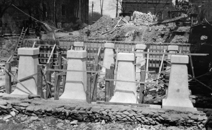 This photo shows the Wayne Stockade area near the construction of the Monroe Street Bridge in the 1920s. Charles Noble, President of the Michigan Southern Railroad, had purchased the land – constructing several buildings on the property, including the trolley powerhouse in the background.