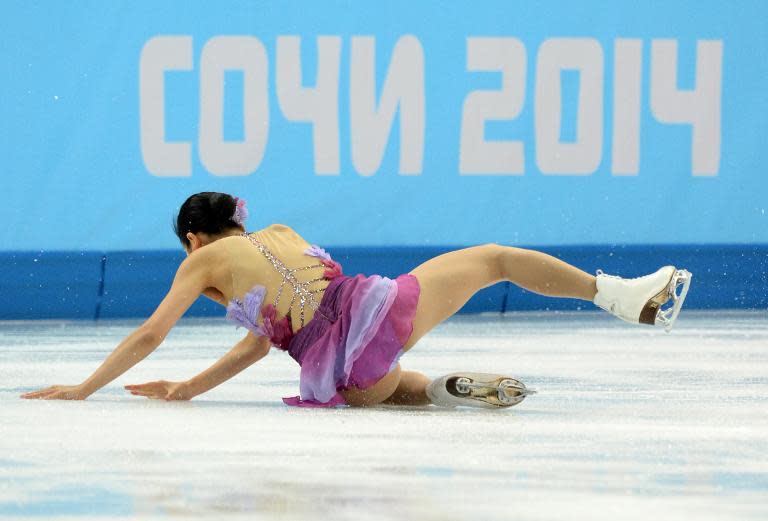 Japan's Mao Asada falls as she performs in the Women's Figure Skating Team Short Program at the Iceberg Skating Palace during the 2014 Sochi Winter Olympics on February 8, 2014