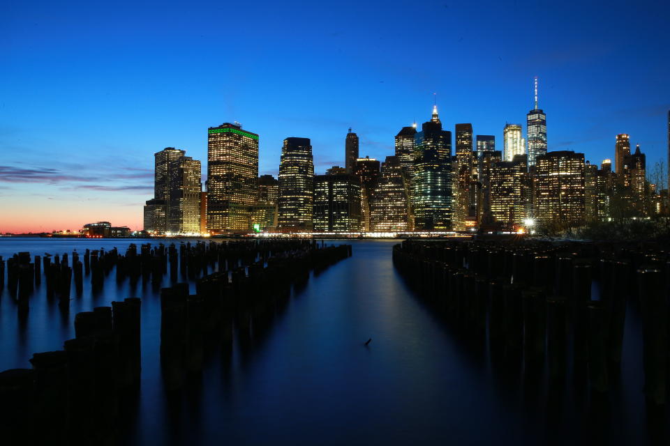 A view of Lower Manhattan from across the East River at the Brooklyn piers at sunset. (Photo: Gordon Donovan/Yahoo News)