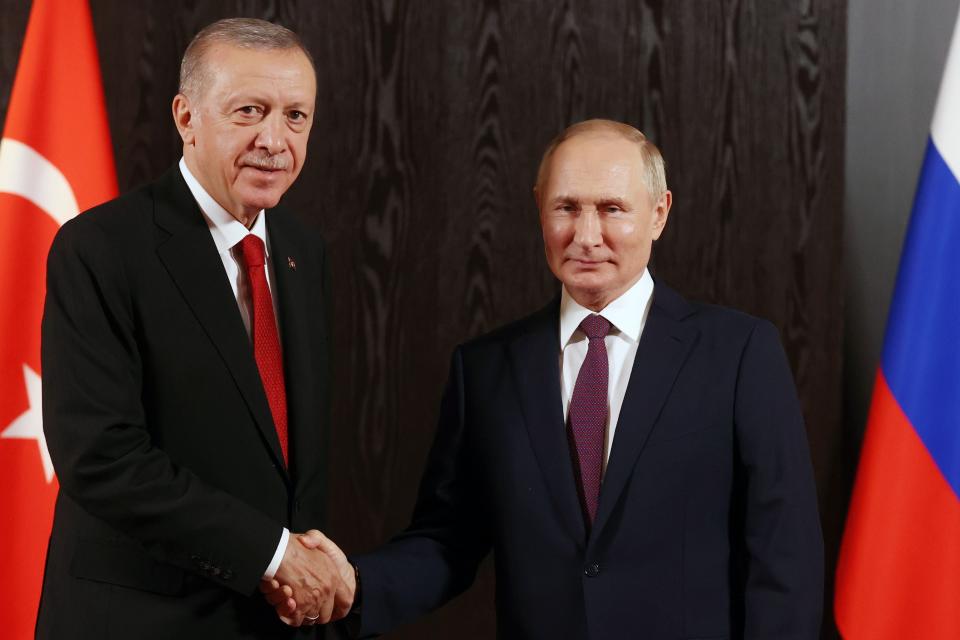 FILE - Russian President Vladimir Putin, right, shakes hands with Turkey's President Recep Tayyip Erdogan prior to their talks on the sidelines of the Shanghai Cooperation Organisation (SCO) summit in Samarkand, Uzbekistan, Friday, Sept. 16, 2022. By halting a landmark deal that allowed Ukrainian grain exports via the Black Sea, Putin has taken a risky gamble that could badly damage Moscow's relations with many of its partners that have remained neutral or even supportive of the Kremlin amid the war in Ukraine. Russia has also played spoiler at the United Nations, vetoing a resolution on extending humanitarian aid deliveries via a key crossing point in northwestern Syria and backing Mali's push to expel the U.N. peacekeepers. Putin's decision to spike the deal could backfire against Russia's own interests, straining Moscow's relations with key partner Turkey and hurting its ties with African countries. (Alexandr Demyanchuk, Sputnik, Kremlin Pool Photo via AP, File)