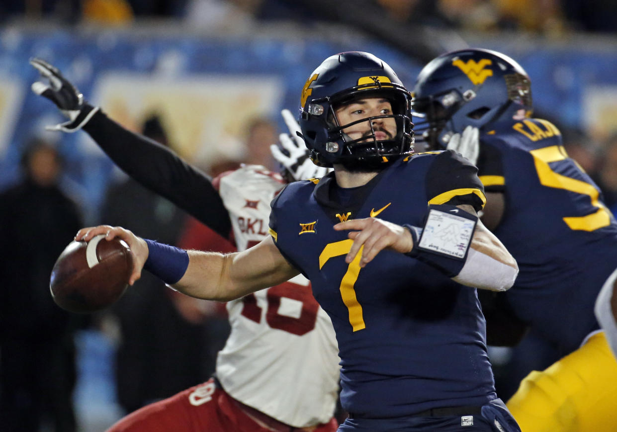 West Virginia QB Will Grier is one of several high-profile players skipping bowl games in preparation for the 2019 NFL Draft. (Getty)