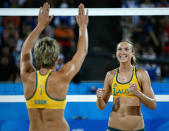 BEIJING - AUGUST 11: Nat Cook (L) and Tamsin Barnett of Australia a point against Andrezza Chagas and Cristine Santanna of Georgia during the beach volleyball event at the Chaoyang Park Beach Volleyball Ground on Day 3 of the Beijing 2008 Olympic Games on August 11, 2008 in Beijing, China. (Photo by Harry How/Getty Images)