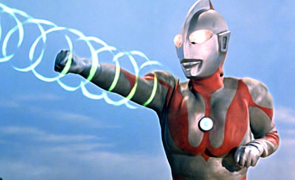 Ultraman zaps a kaiju.