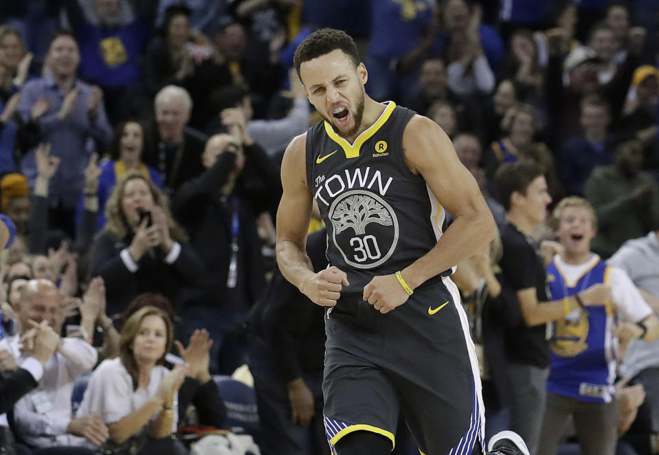 Golden State Warriors guard Stephen Curry reacts after scoring against the Memphis Grizzlies during his first game in three weeks (AP Photo)