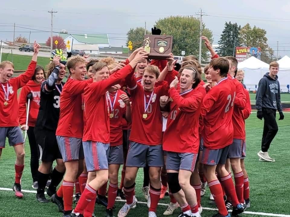 The Dover High soccer team celebrates its Div. II District Tournament championship last fall.