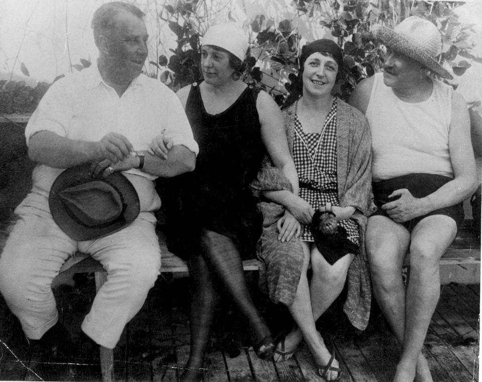 Addison Mizner, left, sits with a "Mrs. Calhoun," Joan Singer and Paris Singer in this undated photo.