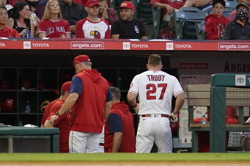 Los Angeles Angels' Mike Trout (27) leaves the field during the third inning of a baseball game against the Boston Red Sox in Anaheim, Calif., Tuesday, June 7, 2022. (AP Photo/Ashley Landis)