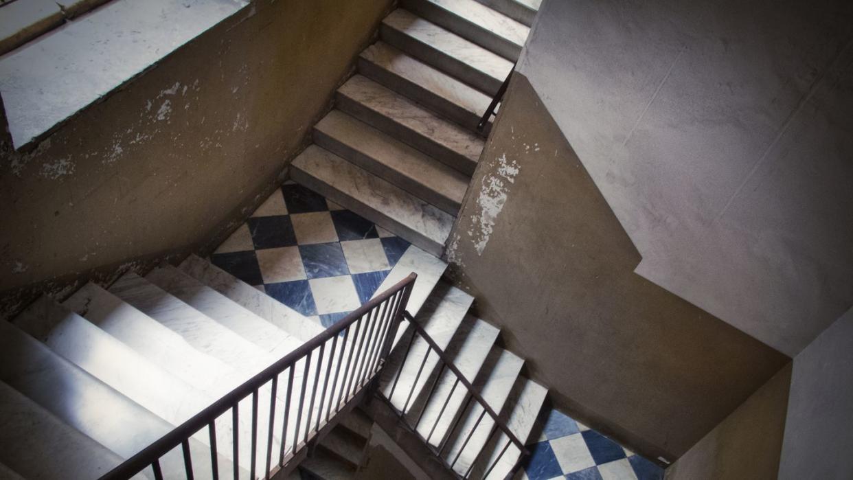 staircase inside an old residential building in catania, italy