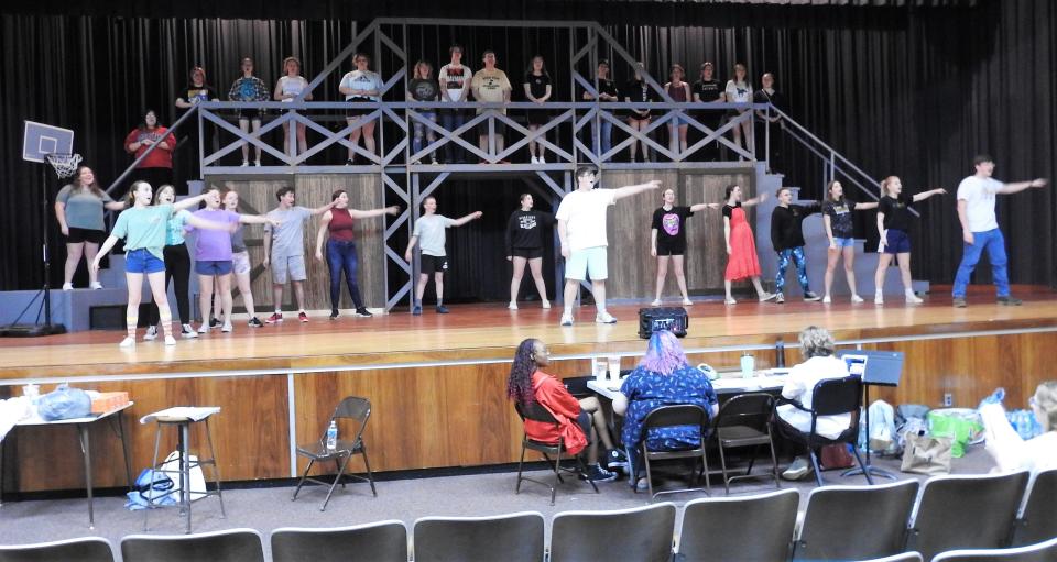 Students rehearse a scene from "Footloose" at River View High School. The musical from 1998 is based on the original 1984 film about a young man who moves to a new small town that has outlawed dancing.