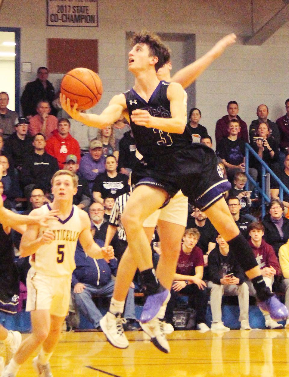 Luke Ihlenfeldt of El Paso-Gridley tries to scoop in a layup against Monticello Friday. Ihlenfeldt had 9 points in the EPG loss.