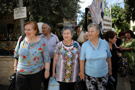 Holocaust survivors wait outside the hall where the annual Holocaust survivors' beauty pageant takes place, before the beginning of the contest, in Haifa, Israel October 14, 2018. REUTERS/Corinna Kern