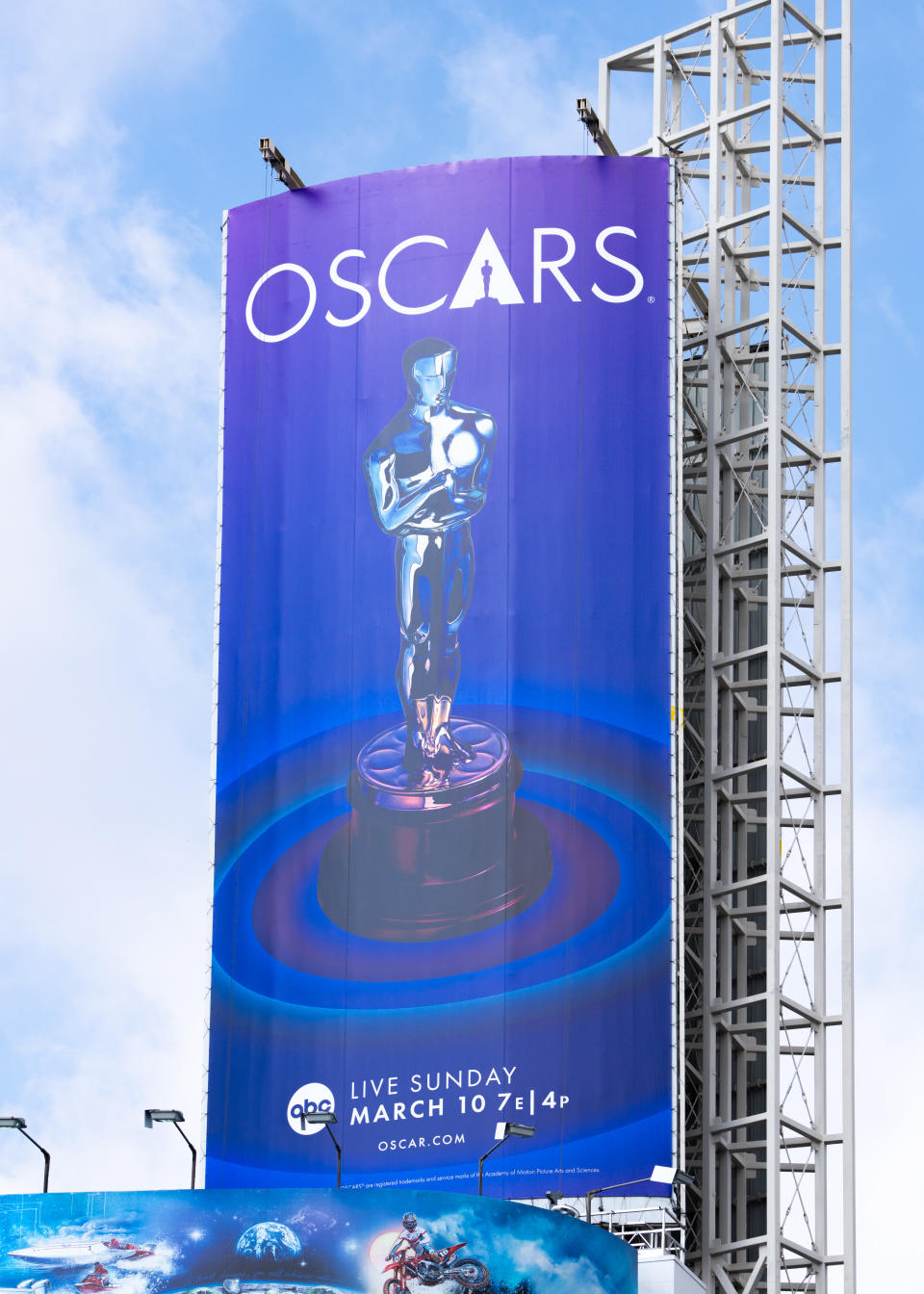 Oscars advertisement banner featuring the iconic statuette, date, and broadcast information