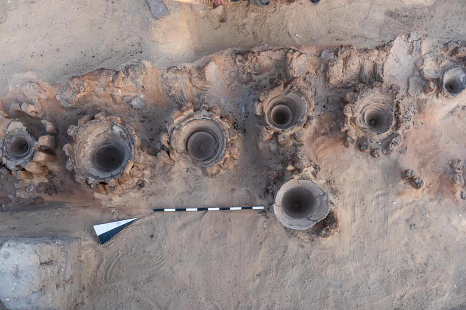 This photo provided by the Egyptian Antiquities Ministry on Saturday, Feb. 13, 2021 shows pottery basins, which archaeologists say had been used to heat up a mixture of grains and water to produce beer, in Abydos, some 450 km (280 miles) south of Cairo, Egypt. The basins were part of what could be the oldest known beer factory unearthed in Abydos, an ancient burial ground dating back to the region of King Narmer, the last king of the Predynastic Period (6000 - 3150 B.C.), according to Mostafa Waziri, secretary general of the Supreme Council of Antiquities. (Egyptian Antiquities Ministry via AP)