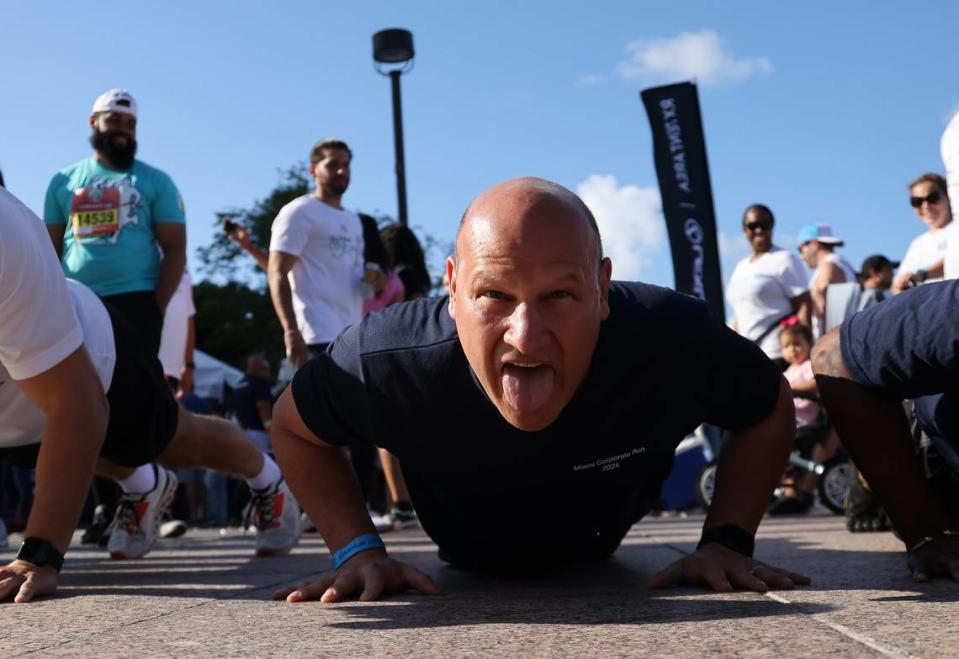 Doing push-ups during warm ups before the start of the race in Bayfront Park.