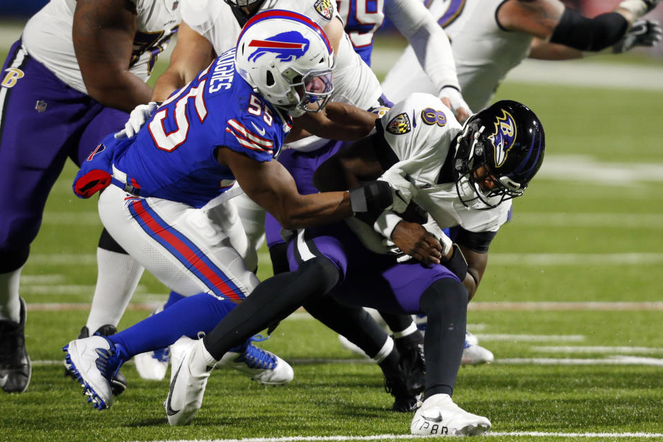 Buffalo Bills defender Jerry Hughes (55) sacks Baltimore Ravens quarterback Lamar Jackson (8). (AP Photo/Jeffrey T. Barnes)