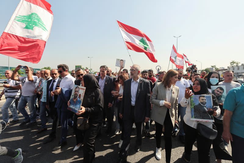 Newly-elected Lebanese independent lawmakers and family members of the victims of the 2020 Beirut port explosion walk towards parliament