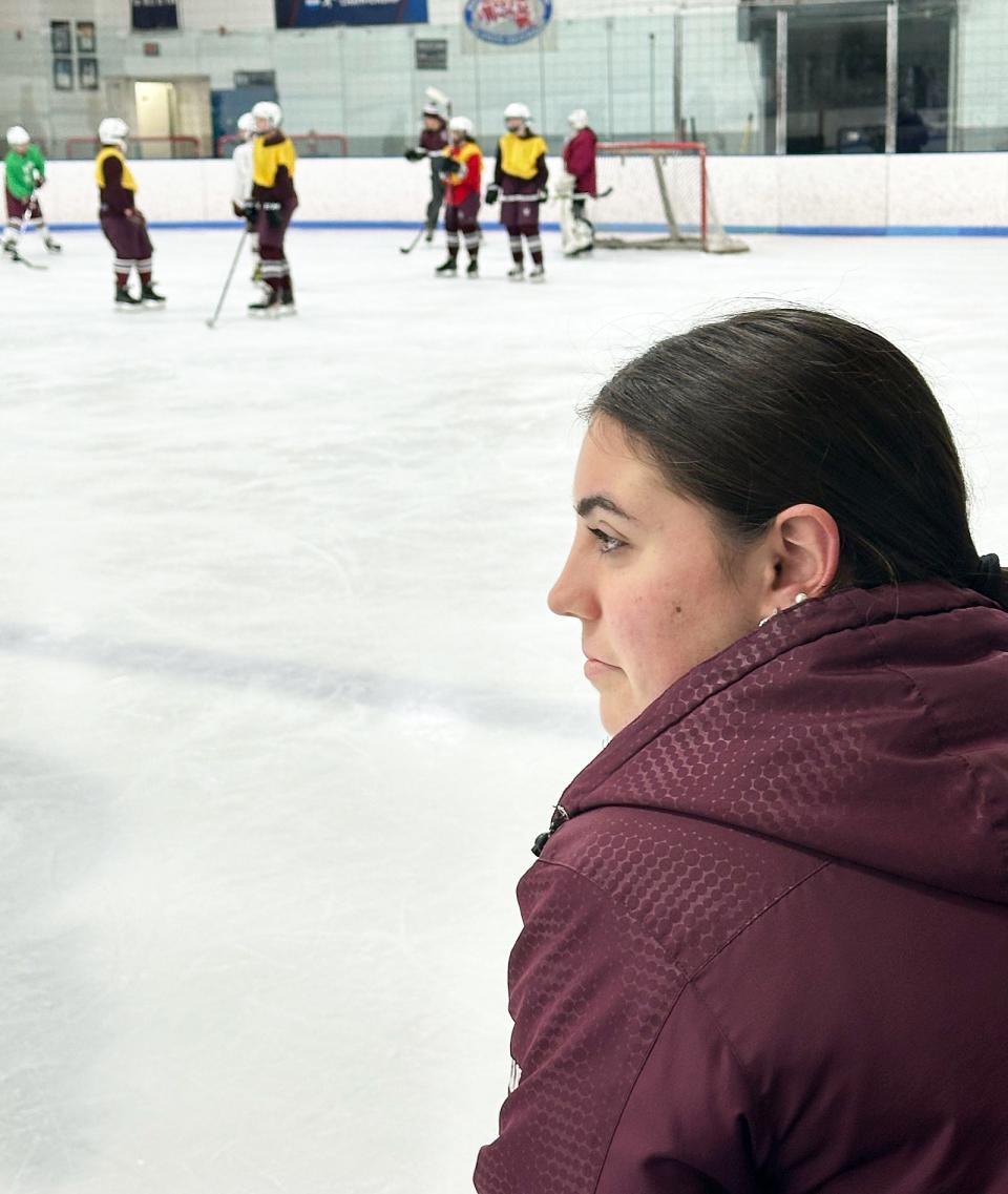 Durfee three-sport athlete and Bishop Stang ice hockey player Emily Curran watches a recent practice at Hetland Ice Arena.