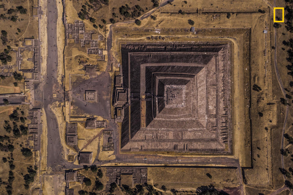 <p>Photograph and caption by Enrico Pescantini/National Geographic Travel Photographer of the Year Contest. — “Teotihuacan means ‘the place where the gods were created,’ and that’s the exact feeling visitors have when they walk along the Avenue of the Dead at this Mexican archeological site. This pyramid was dedicated to the god of Sun, and I found it mesmerizing how the rising sun in the picture conquered just half the image, while the other half is in the shadows.<br>I have always loved archeology and ancient civilizations, so I couldn’t wait to visit Mexico and explore the remains of the pre-Columbian civilization. I planned my visit to Teotihuacan at sunrise, to get a combination of golden sunlight, play of shadows and few crowds around. I flew my drone to see if the image I had in my mind was really out there: Luckily for me, this frame was just waiting for my camera!” Teotihuacan, Mexico. </p>