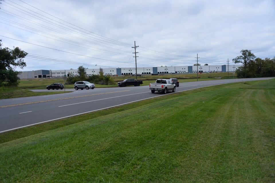 Traffic moves along Sterling Road near where it joins with Downsville Pike on Friday. A potential entrance for a planned elementary school could be built across from Sterling Road.