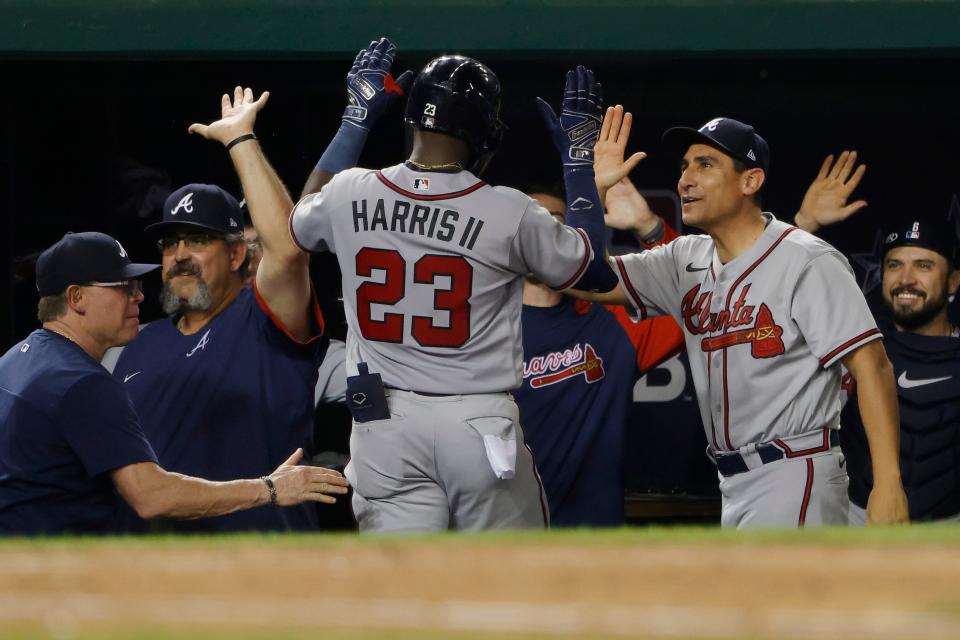 Michael Harris II (23) celebrates with Atlanta Braves teammates after hitting a home run against the Washington Nationals.