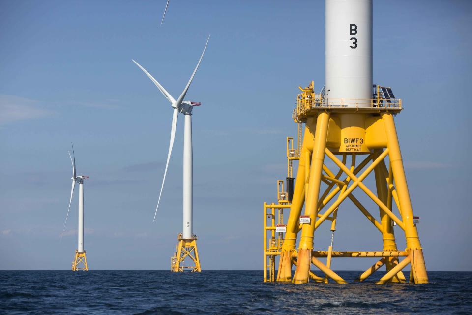 FILE - Offshore wind turbines stand near Block Island, R.I. on Aug. 15, 2016. The Biden administration says it will hold its first offshore wind auction next month. It's offering nearly 500,000 acres off the coast of New York and New Jersey for wind energy projects that could produce enough electricity to power nearly 2 million homes. (AP Photo/Michael Dwyer, File)